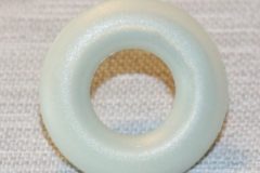 Genomföring dörrlåsknapp