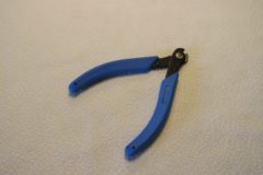 Tång för demontering av hog-rings